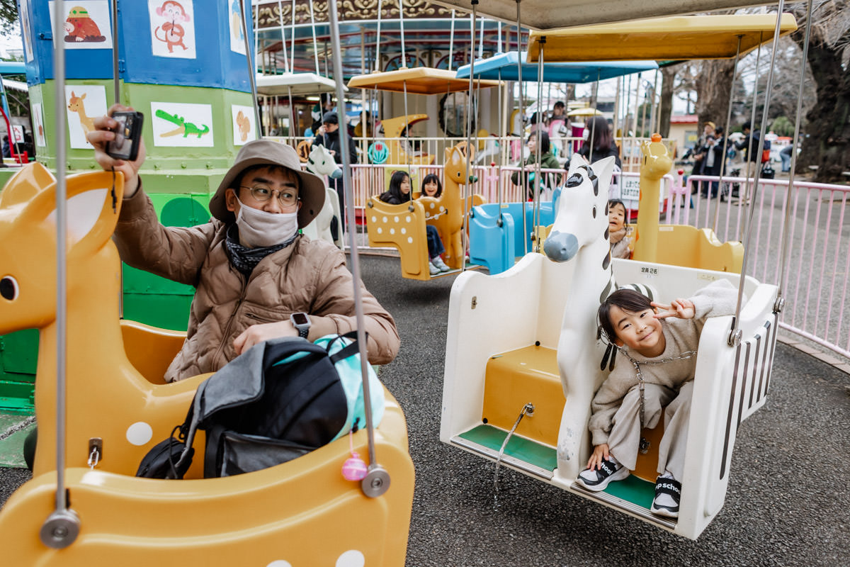 family taking selfies on the ride